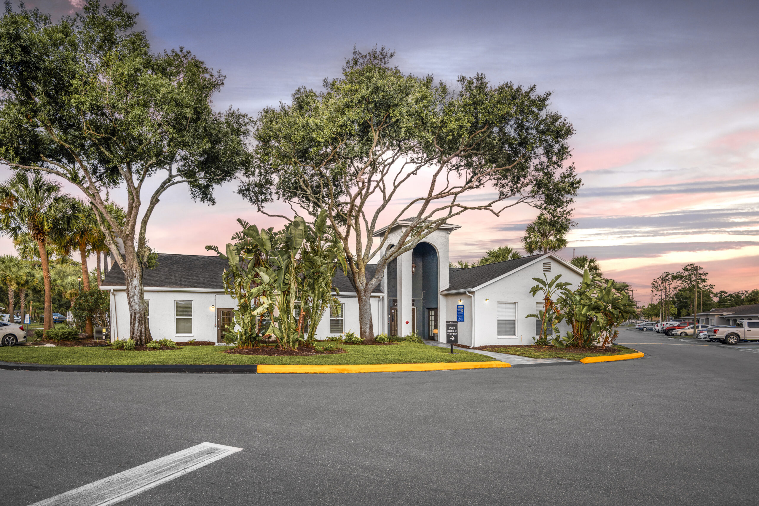 Summit west apt building with parking lot